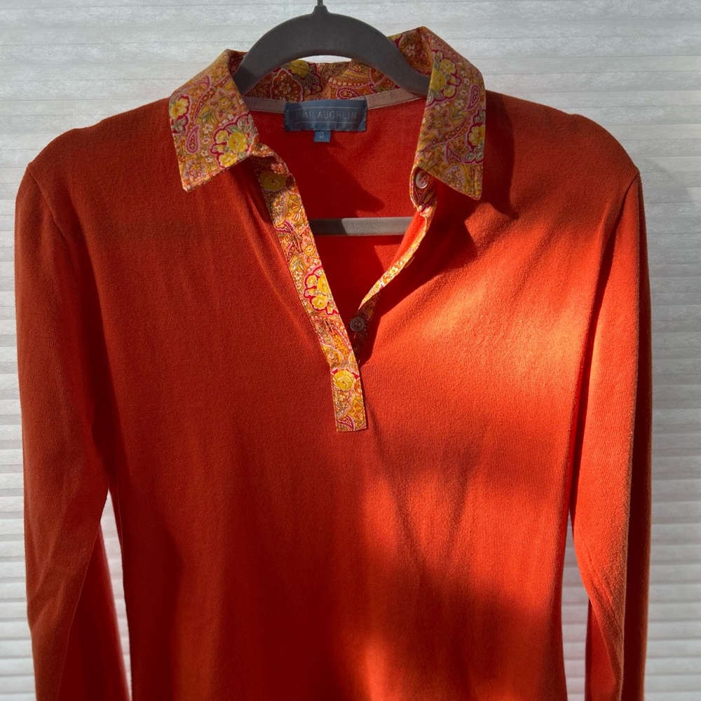 J.McLaughlin tangerine colored long sleeve top with floral collar details.